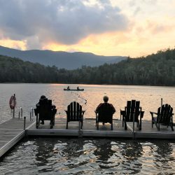 Enjoying the sunset from an Adirondack chair on Heart Lake