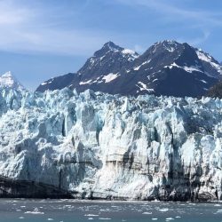 Icebergs floating in Tarr Inlet infront of the face of Margerie Glacier, with the Fairweather Mountains looming in the background in Glacier Bay National Park