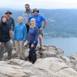 group of hikers on a rock