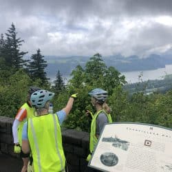bikers overlooking a lake