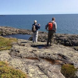 Two hikers overlook Lake Superior in Isle Royale National Park