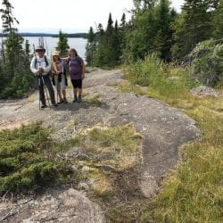 Hikers pose on a trail in Isle Royale National Park