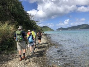 hikers along the ocean