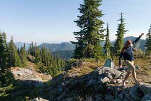 hiker balancing on rock