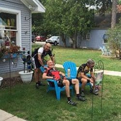 people relaxing outside a house