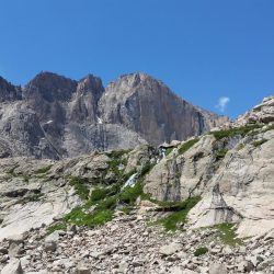 Looking up at Timberline Falls with towering Powell Peak in the background